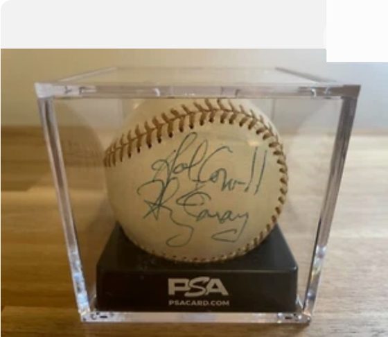 Harry Caray and Bill Veeck dual-signed baseball, PSA authenticated, in a display case